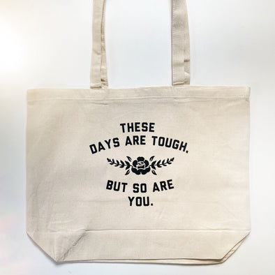 THESE DAYS ARE TOUGH, BUT SO ARE YOU - Canvas Tote Bags